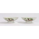 Pair of Japanese porcelain shallow bowls, decorated with a low tree and a locust, red mark to the
