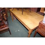 Pine farmhouse style dining table, with frieze drawer, raised on turned legs, 82cm x 152cm