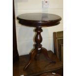 "Ancient Mariner" mahogany occasional table, the circular top raised on a turned stem and tripod