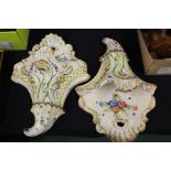 Pair of Bassano pottery wall pockets, shell caped with foliate design, 39cm high, (2)