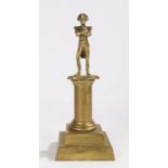 19th Century brass column depicting Napoleon with arms crossed, 29.5cm high