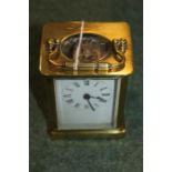 French brass cased carriage clock, the white enamel dial with Roman numerals, 14cm high to top of