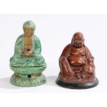 Seated buddha incense burner, the pottery buddha holding a bowl above a platform base, 12.5cm