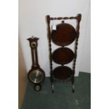Oak cased aneroid barometer together with a 20h Century oak cake stand (2)