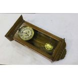 Oak cased Edwardian wall clock, the silvered dial with Arabic numerals, 33cm wide, 69cm high