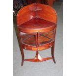 Early 20th Century mahogany display cabinet, converted from a washstand, the glass framed doors