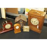 Collection of clocks, to include four desk clocks with Roman and Arabic numerals and a cuckoo