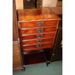 Early 20th Century dark stained music cabinet, with five drop-front drawers above an open recess,