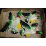 Graduated set of three plaster of Paris flying ducks, the largest 26cm wide (3)