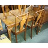 Walnut suite of dining furniture, to include an extending dining table, a set of six chairs and a