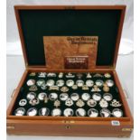 CASED SET OF SOLID SILVER COINS & MILITARY BADGES, CONTAINS 52 SOLID SILVER COINS