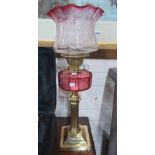 ANTIQUE OIL LAMP WITH RUBY SHADE