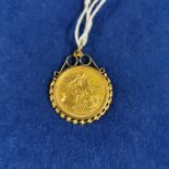 1996 GOLD HALF SOVEREIGN IN 9CT GOLD MOUNT