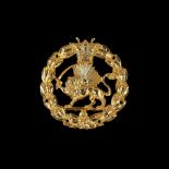 A gilt Qajar Military badge, gilt bronze [Iran, c. 1920]