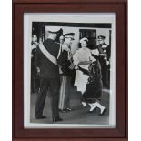 Princess Margaret Curtsies as she shakes the hand of the Shah of Iran