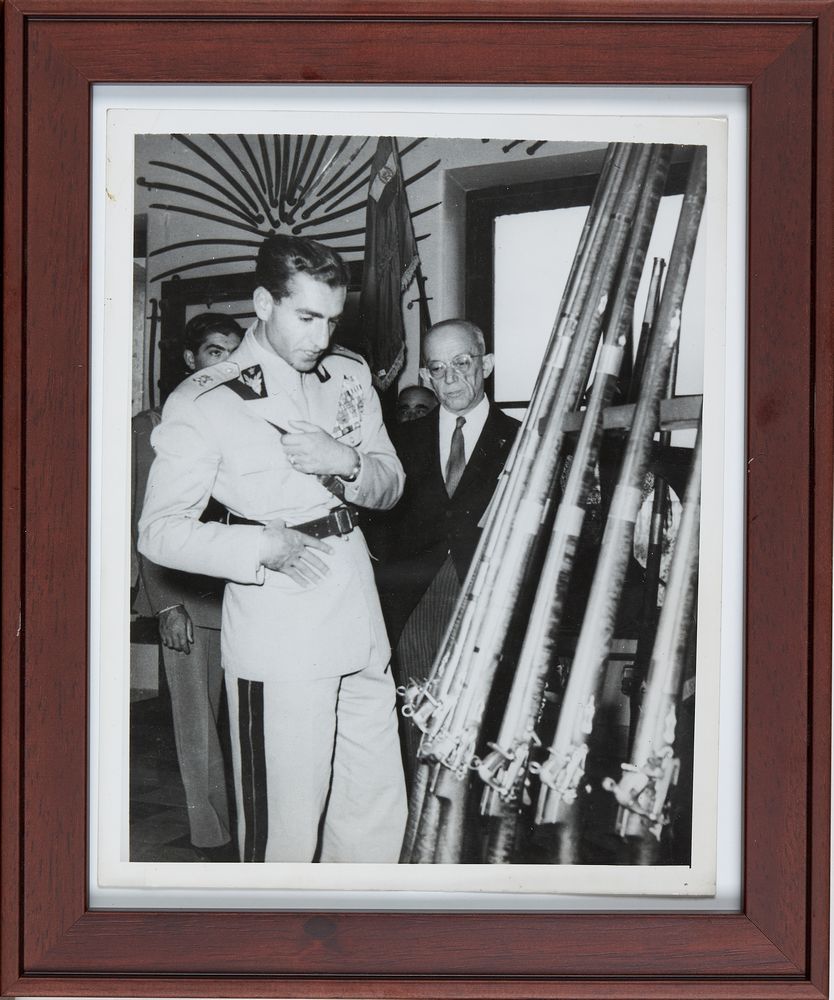 Mohammad Reza Shah Pahlavi inspects arms during a visit to the Officer's University Museum