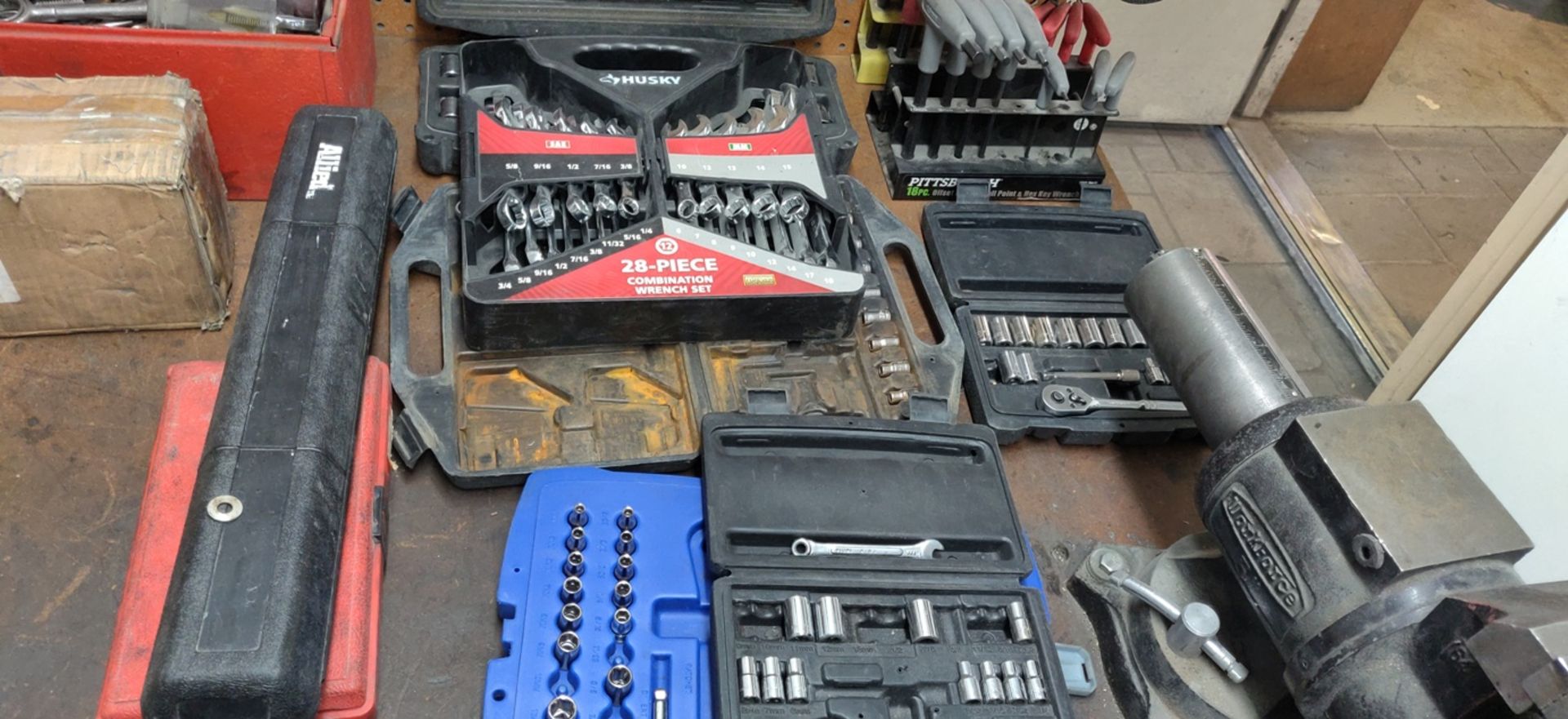 ASSORTED WRENCHES ON BENCH