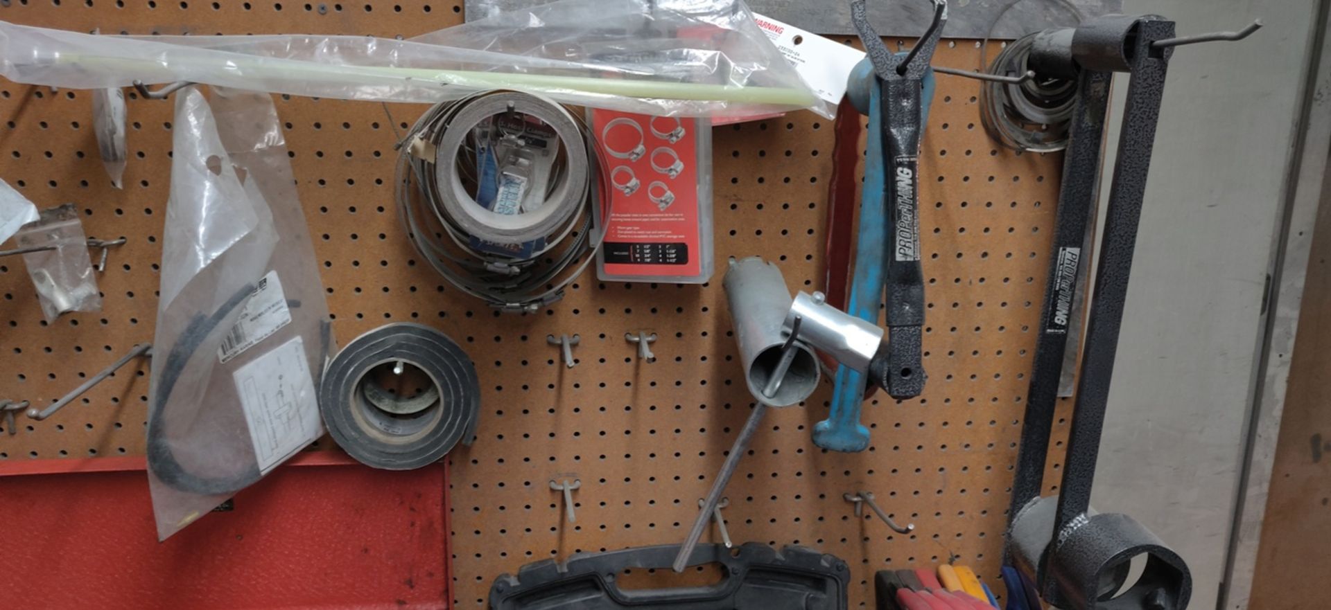 CONTENTS OF 2 SHELVES, NAILS, DRY WALL SCREWS, TIE STRAPS, ETC +BACK WALL OF WORK BENCH, O CLAMPS.. - Image 9 of 9