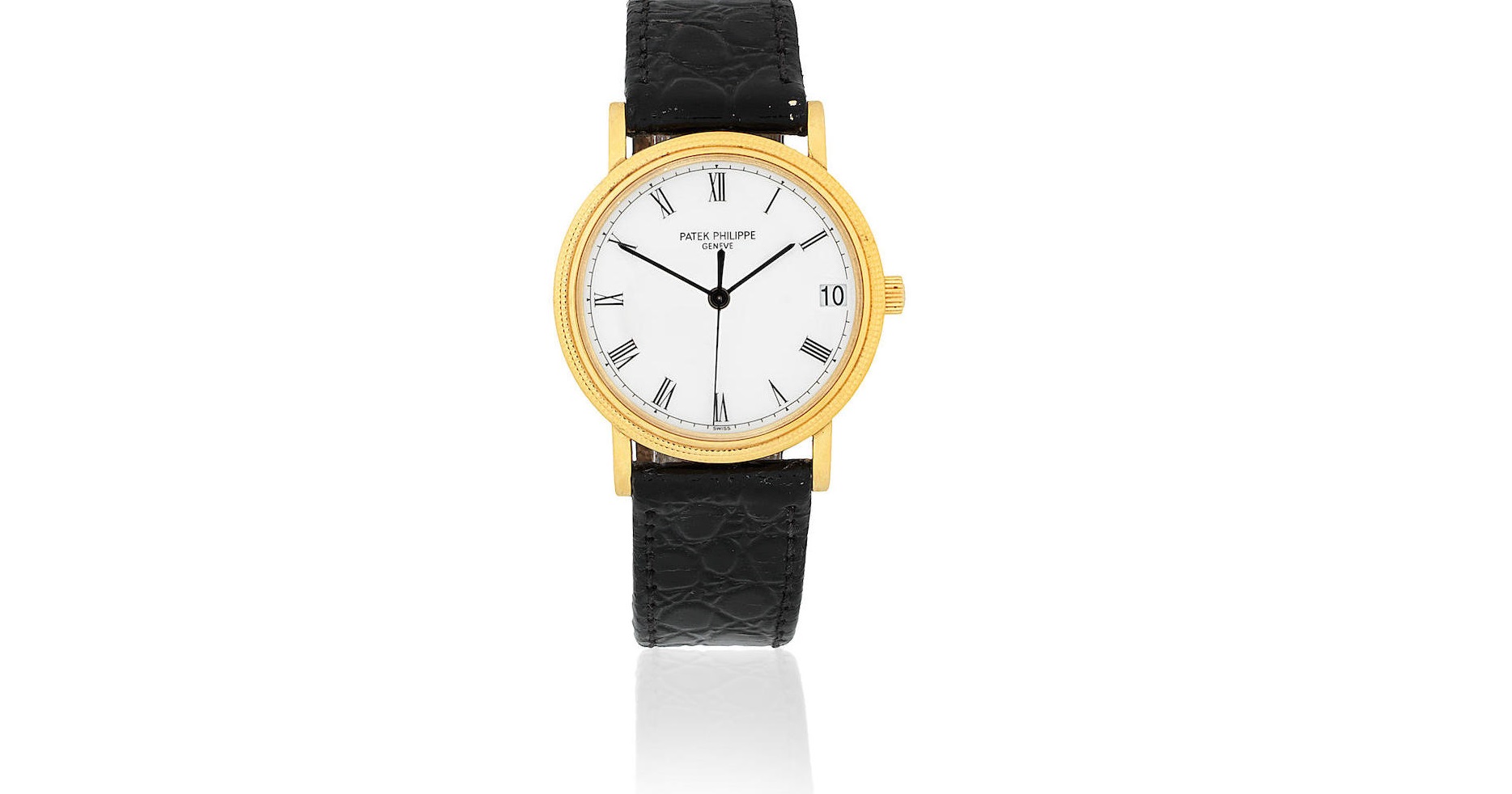 Patek Philippe. An 18K gold automatic calendar wristwatch