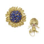 A lapis lazuli flower brooch together with a lion brooch