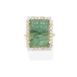 A carved emerald and diamond ring