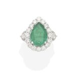 An emerald and diamond ring