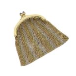 A tri-color gold mesh purse pendant
