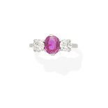 A pink sapphire and diamond ring