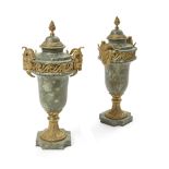 A pair of Louis XVI style gilt bronze mounted green marble covered urns 20th century