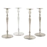 Four American sterling silver base loaded candlesticks by Shreve & Co., San Francisco, CA, 20th c...