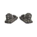 A pair of patinated metal figures of recumbent lions 20th century