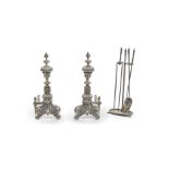 A pair of English Baroque Style silvered bronze and metal andirons with tools and stand 19th century