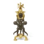 A French patinated and gilt bronze figural mantel clock Late 19th century