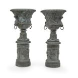 A pair of Neoclassical style painted cast iron urns on integral bases 20th century