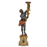 A Venetian Baroque style carved wood figural torchère
