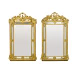A pair of Louis XV style gilt wood mirrors