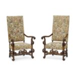 A Pair of Continental Baroque Style Upholstered Walnut Armchairs Late 19th/early 20th century