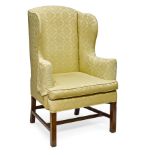 A George III Upholstered Mahogany Wing Chair Third quarter 18th century