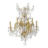 A French gilt bronze and rock crystal eight light chandelier
