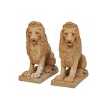 A pair of Painted Composition figures of seated lions 20th century