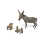 A Vienna cold painted bronze figure of a donkey and two miniature groups of dogs 20th century