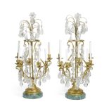 A pair of Louis XVI style gilt bronze, rock crystal and malachite veneered seven light girandoles