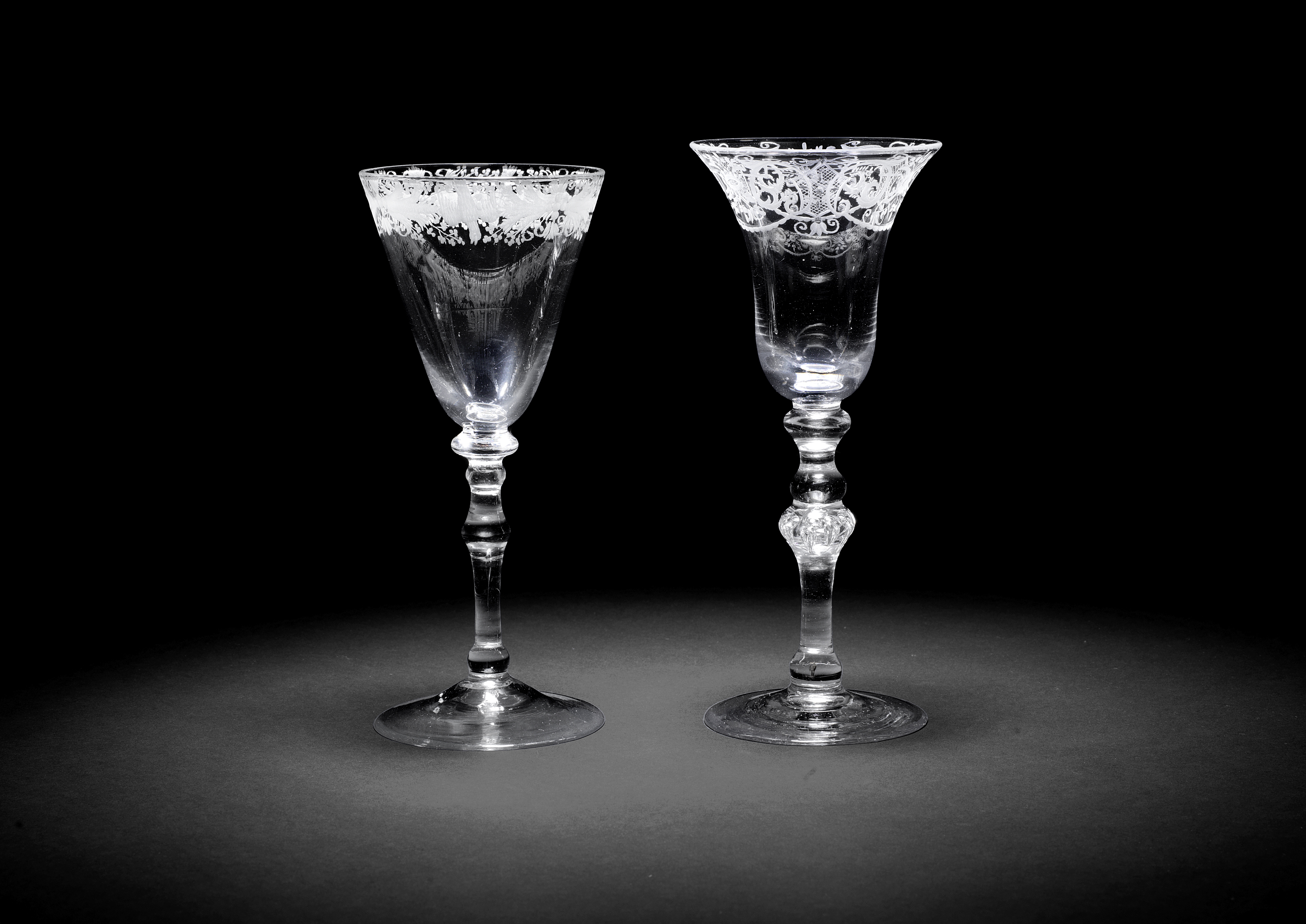 Two engraved light baluster wine glasses, circa 1750