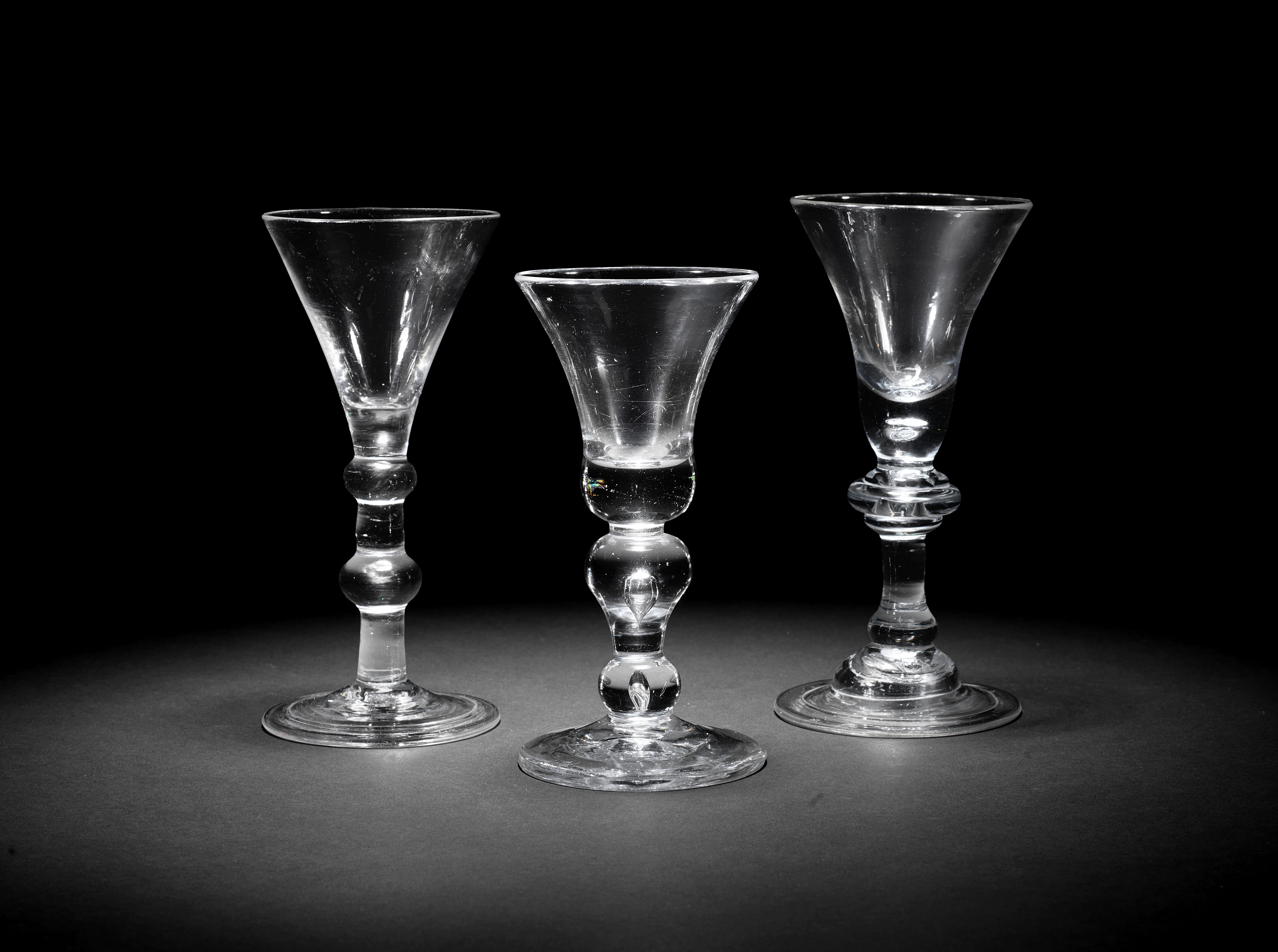 Three baluster wine glasses, circa 1710-30