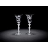 A pair of engraved opaque twist wine glasses, circa 1765