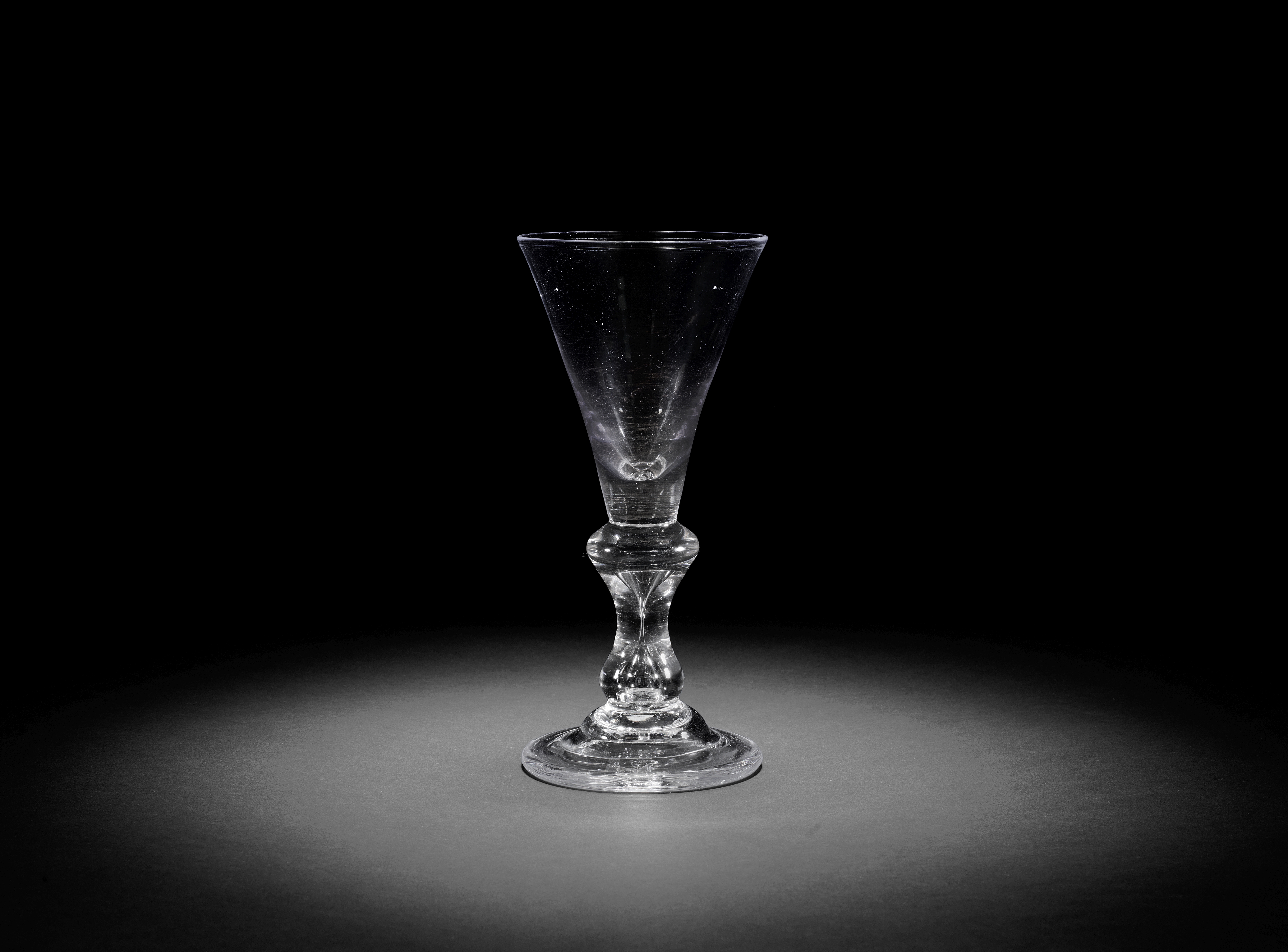 A heavy baluster large wine glass or goblet, circa 1710-20