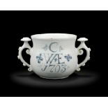 A rare English delftware posset cup, dated 1703