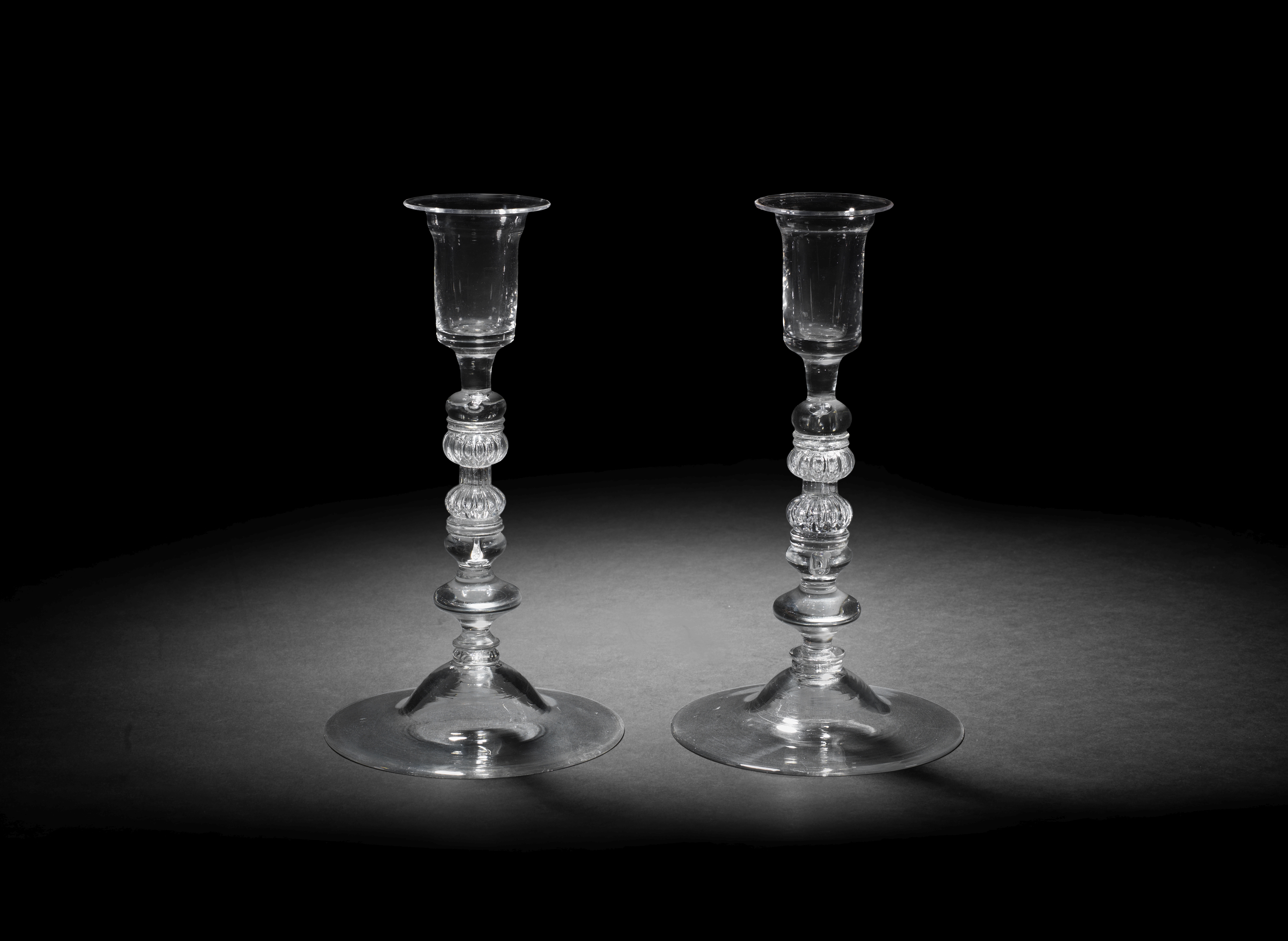 A pair of composite-stem candlesticks, circa 1740-50