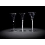 Three toasting glasses or wine flutes, mid-18th century