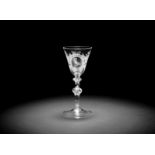 A Dutch engraved armorial light baluster wine glass, circa 1760